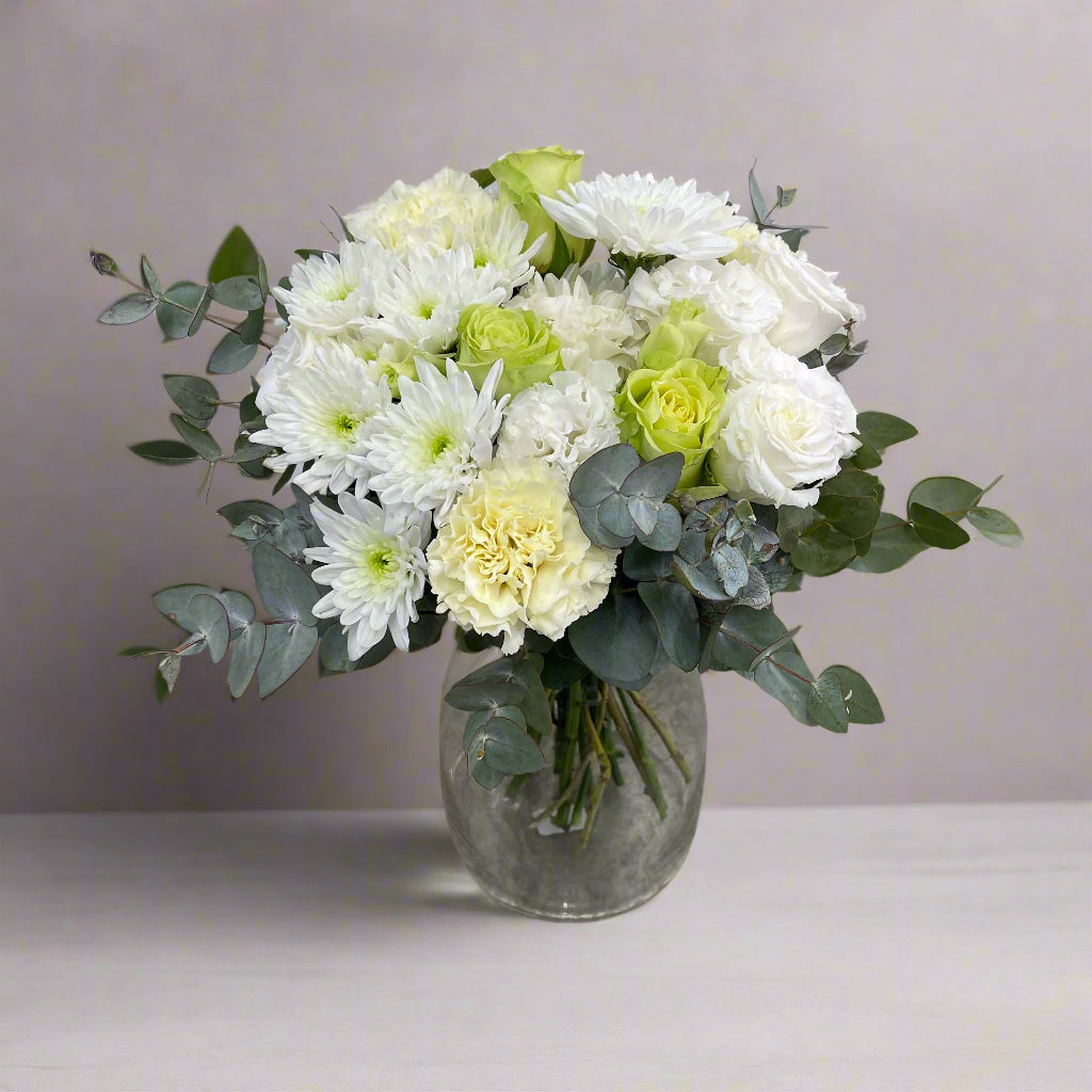 White and green bouquet arranged with seasonal blooms, part of The Simple Collection 2025.