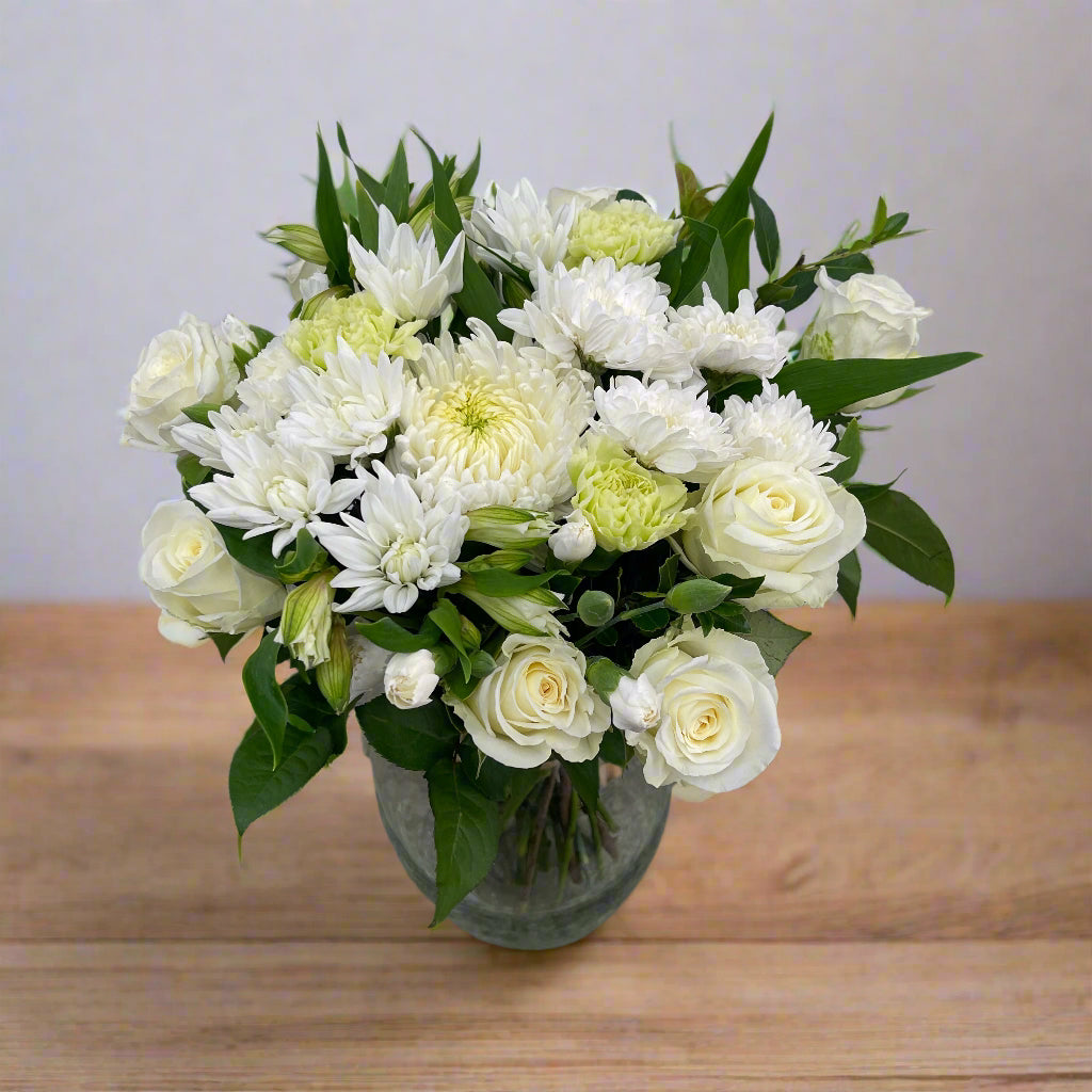 White and green bouquet with roses on a clean background