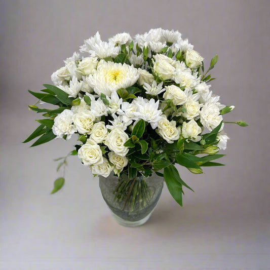 White and green flower bouquet on neutral background