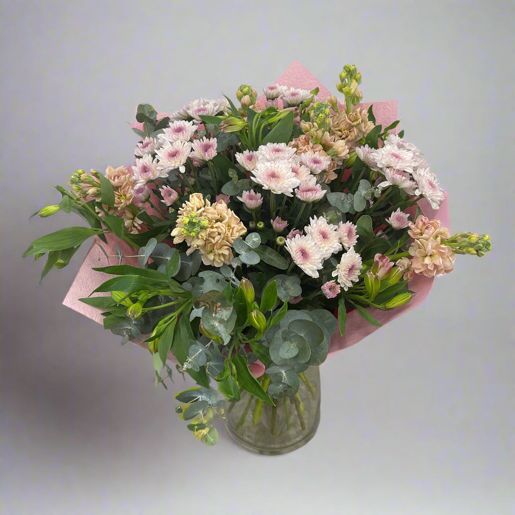 Winter Solstice pink and green flower bouquet handmade by Sandringham florist.
