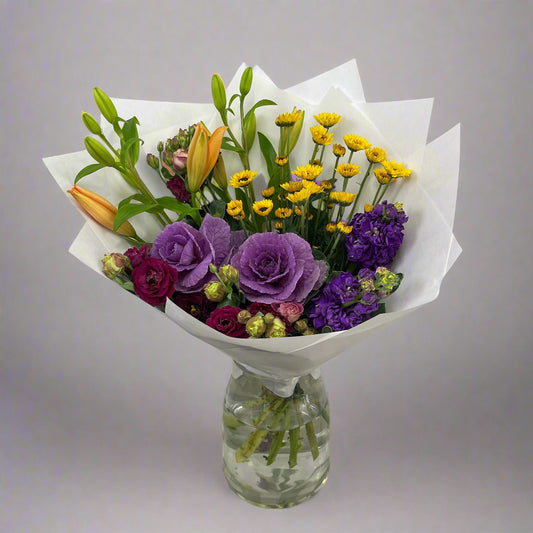 Large colourful bouquet with purple, yellow, and orange flowers, perfect for birthdays or events, available for same-day Melbourne delivery.