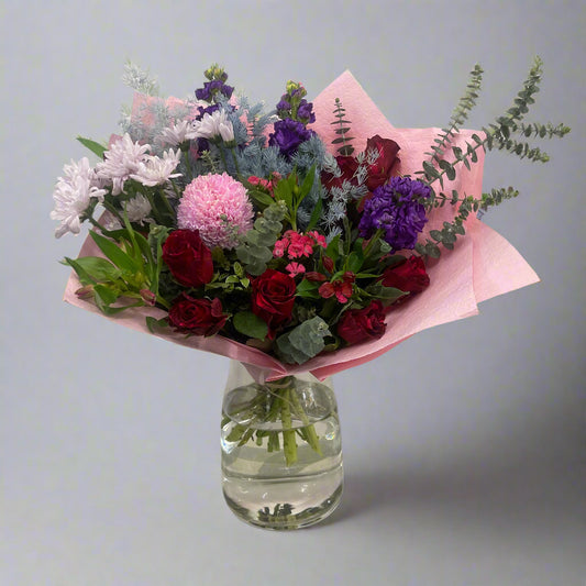 Large bouquet with red, pink, and blue flowers, perfect for birthdays or celebrations, available for same-day Melbourne delivery.