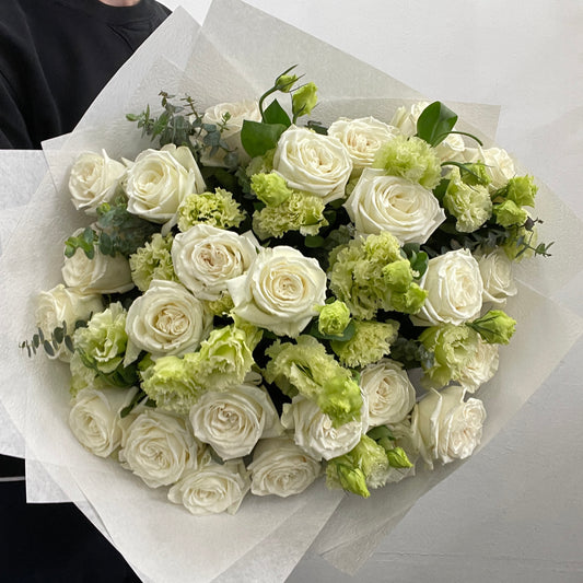 Large white and green flower bouquet featuring Ecuador white roses and green lisianthus, made by Adam The Flower Man in Sandringham.
