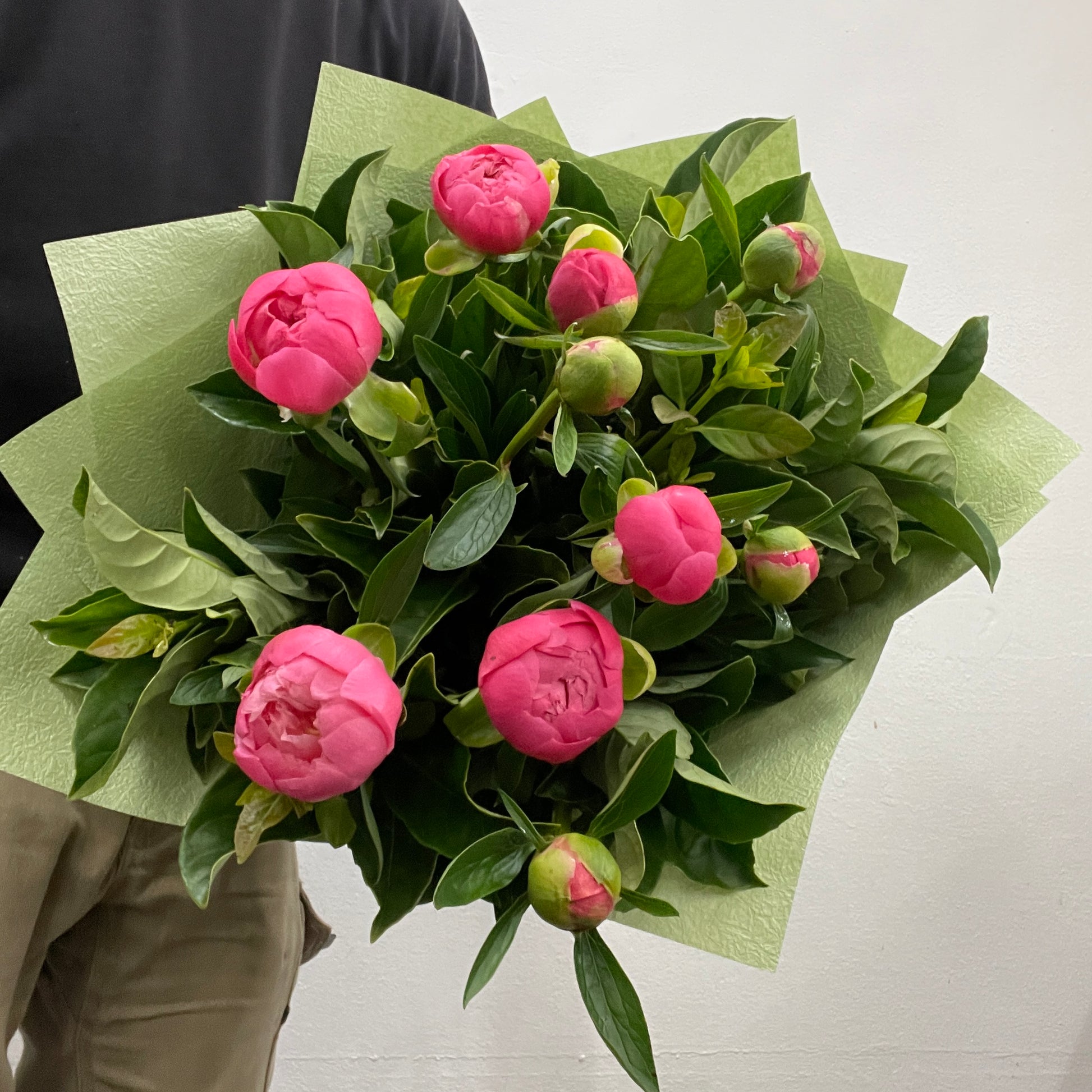 Rounded bouquet of Coral Charm pink peonies arranged in mass, made by Adam The Flower Man in Sandringham.