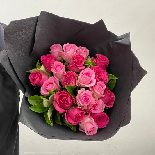Rounded bouquet featuring roses in two pink shades with viburnum foliage in pink and green tones, part of the Spring Limited Collection 2025 by Adam The Flower Man.
