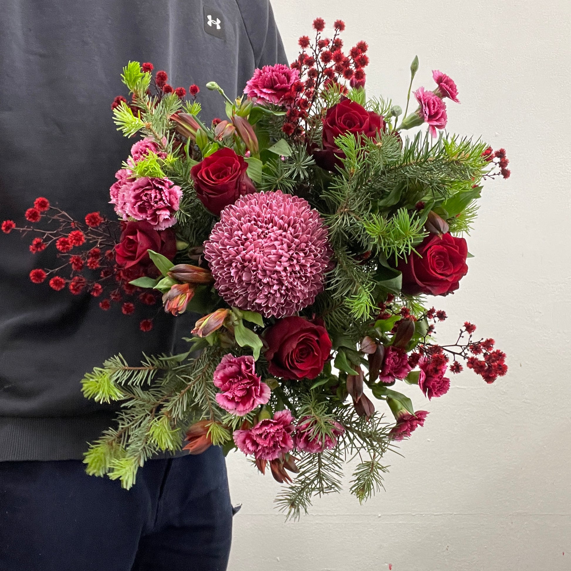 Christmas No. 10 bouquet with red roses and festive greenery