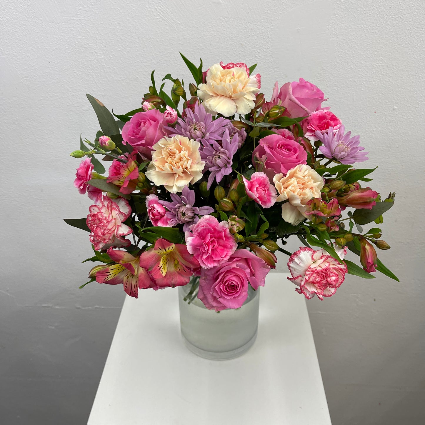 Happy bright floral arrangement with fresh seasonal blooms