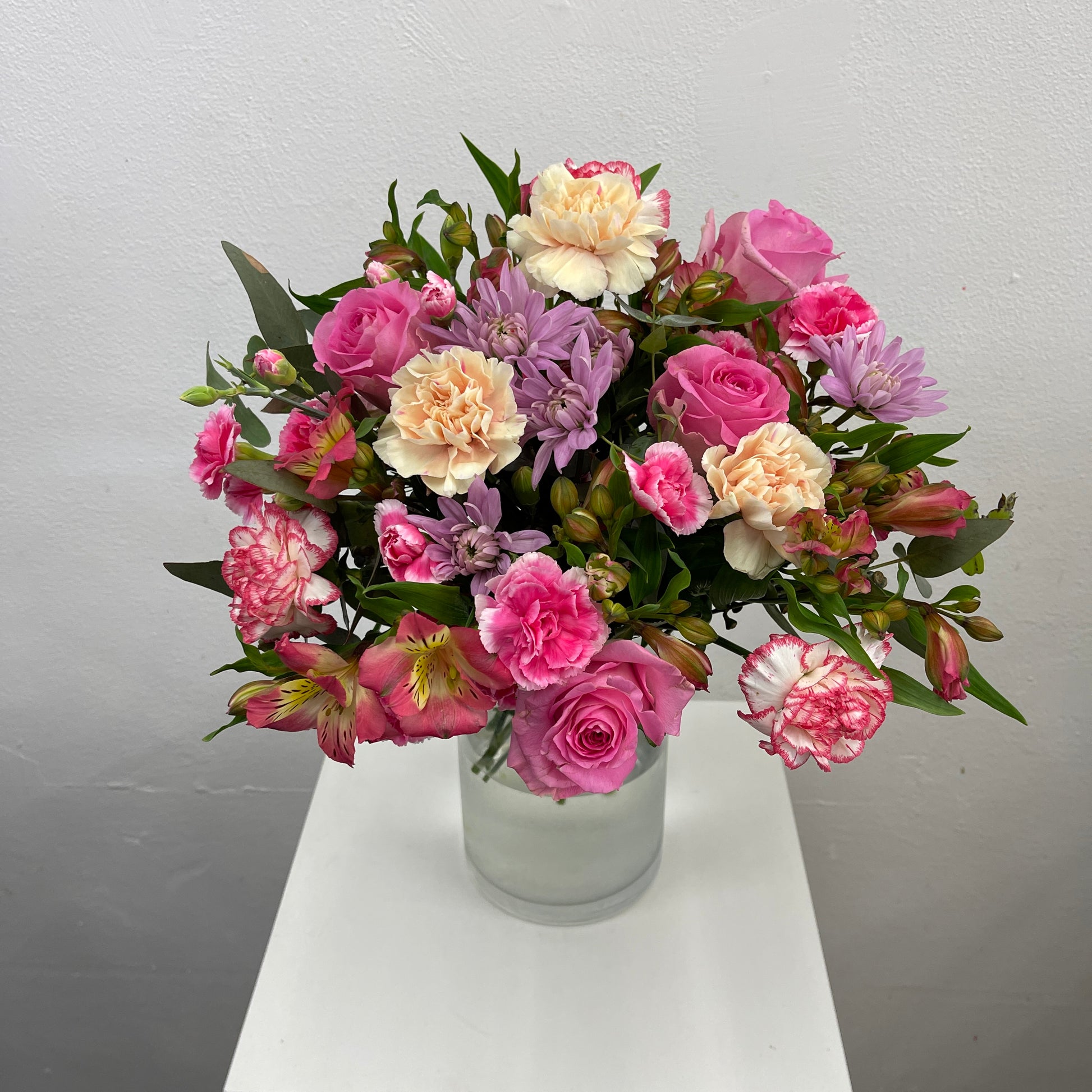 Happy bright floral arrangement with fresh seasonal blooms
