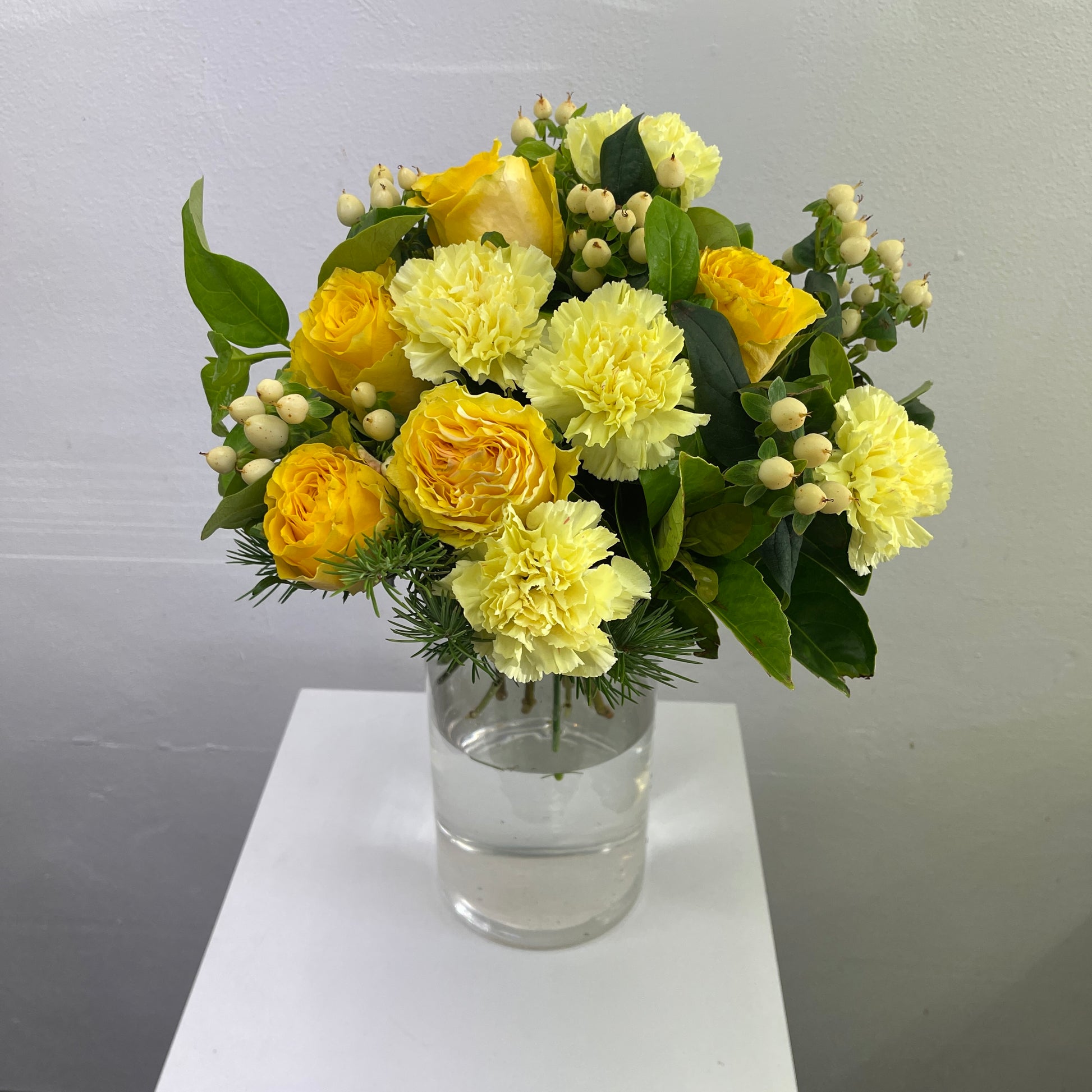 Happy bright floral arrangement with fresh seasonal blooms
